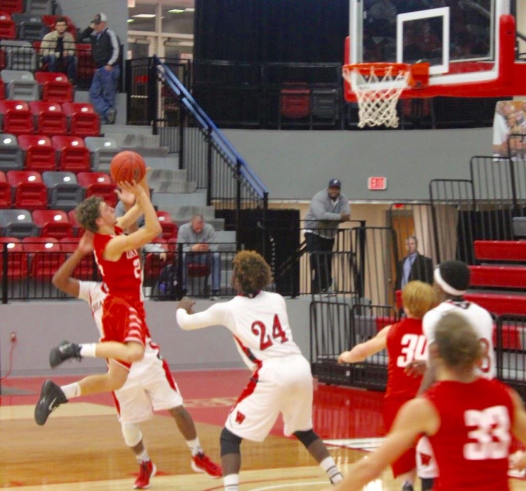 Ohatchee's Austin Tucker soars through the air towards the basket in Tuesday night's Calhoun County Tournament game with Weaver. (Photo by Carrie Howell)