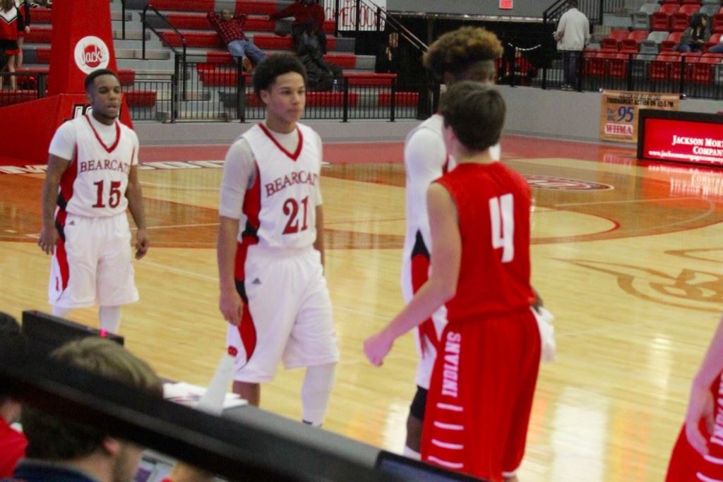 Weaver's Maurice Goodman (21) is approached by Ohatchee's Ben Glass (4) in the post-game handshake after Tuesday night's game. Goodman played a big role in the Bearcats' victory. (Photo by Carrie Howell) 