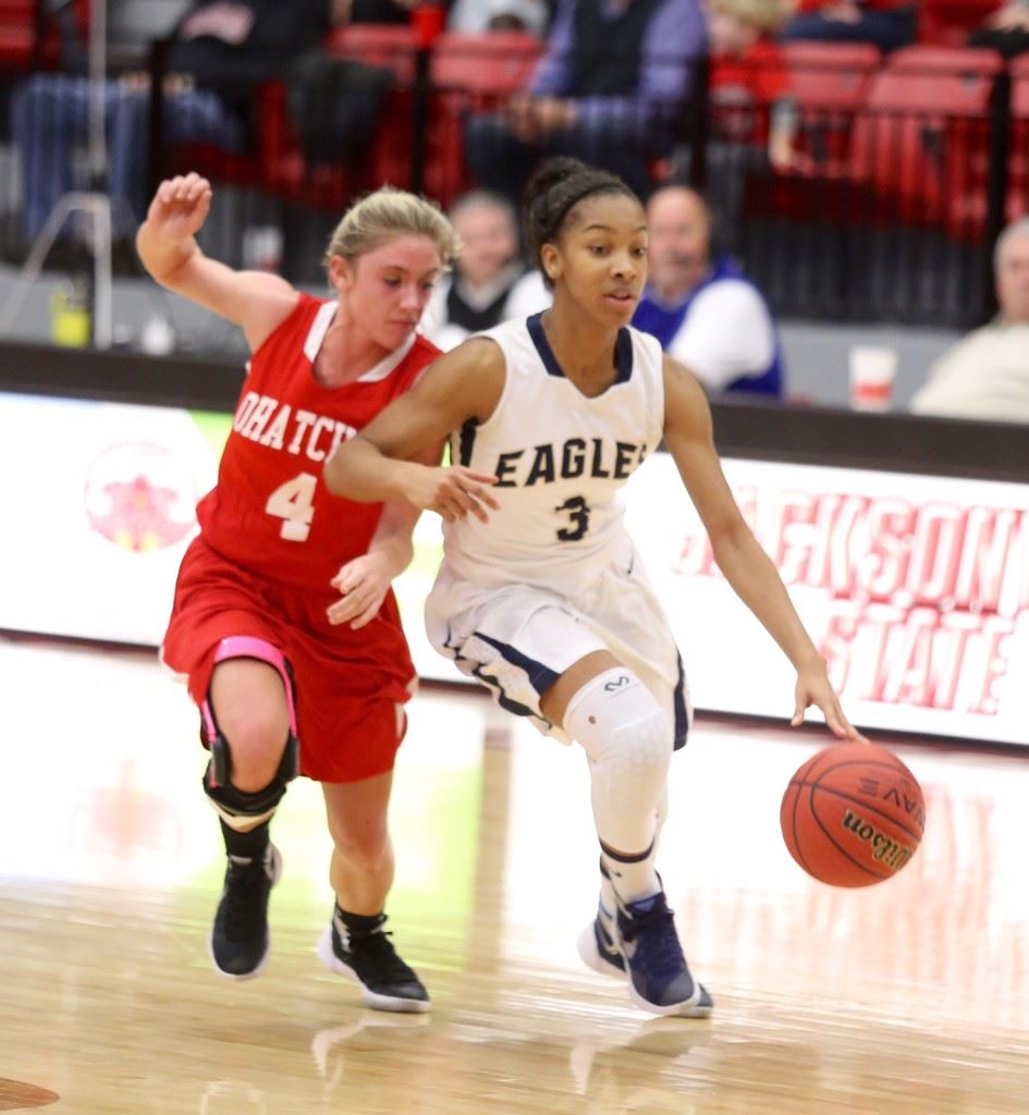 Jacksonville's Kyra Williams (3) drives past Ohatchee's Hannah Howell during their Calhoun County Tournament quarterfinal game Thursday. Williams scored 23 points to lead the Golden Eagles. (Photos by Kristen Stringer/Krisp Pics Photography)