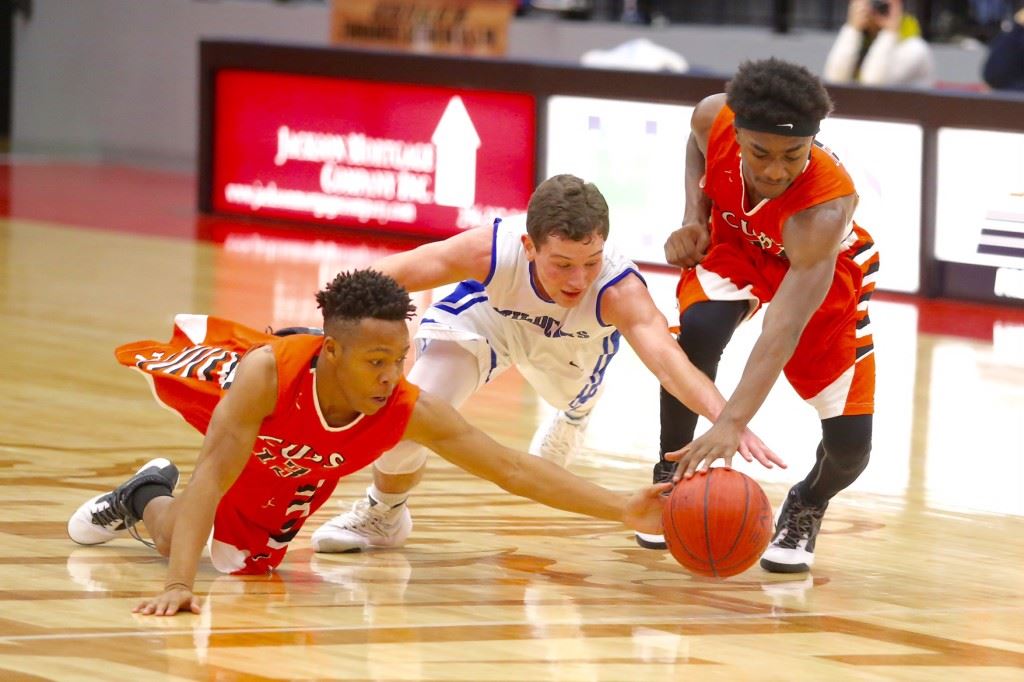 White Plains' Jerod Guthrie (C) lunges between Alexandria's A.J. Martin (13) and Jamal Tucker for a loose ball during Thursday's game. On the cover, the Wildcats celebrate getting past the Valley Cubs. (Photos by Kristen Stringer/Krisp Pics Photography)