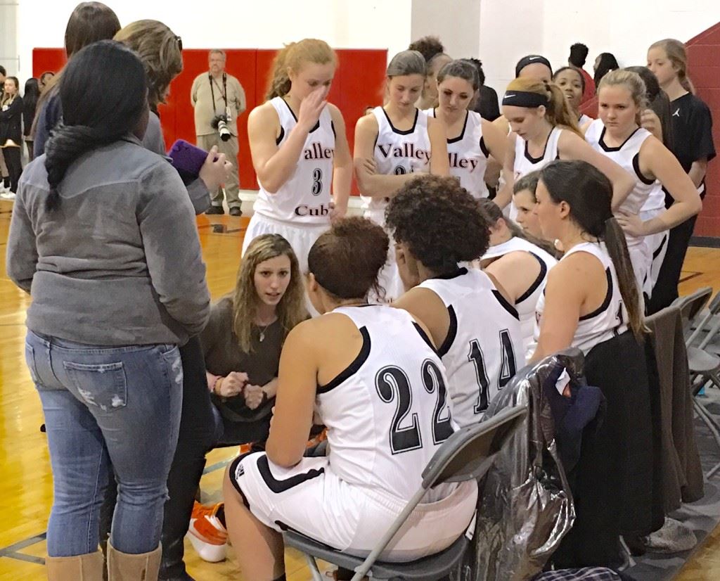 Alexandria coach Jordan Costner gives her troops instruction during a timeout Monday. The Lady Cubs came from seven down to start the fourth quarter to winning in double overtime.