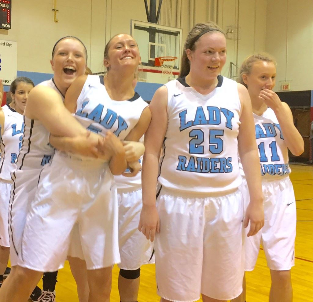 Kara Perry (L) puts a big bear hug on teammate Atleigh Brannon after Pleasant Valley clinched a spot in the 3A Northeast Regional with its fifth victory of the season over Ohatchee Monday night.