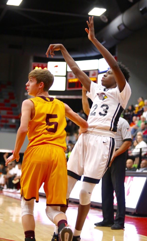 Spring Garden's Dylan Rogers (5) can only watch the results as Kevion Nolan follows through on a jumper from the corner. Nolan scored 25 of his 37 points in the second half Thursday. On the cover, D.J. Heath strikes a defensive pose against Dakota Lambert. (Photos by Kristen Stringer/Krisp Pics Photography)