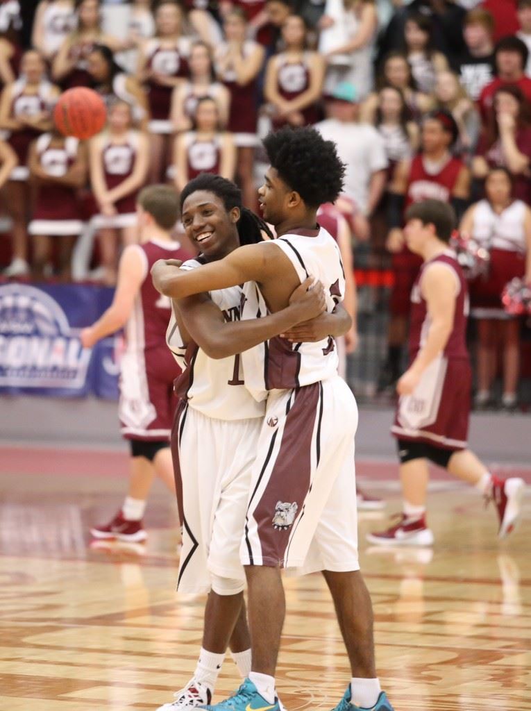 Hakeem Ross (L) and Willie Thomas celebrate Friday's regional semifinal victory that gives Schuessler Ware (below) another game to coach. (Photos by Kristen Stringer/Krisp Pics Photography)