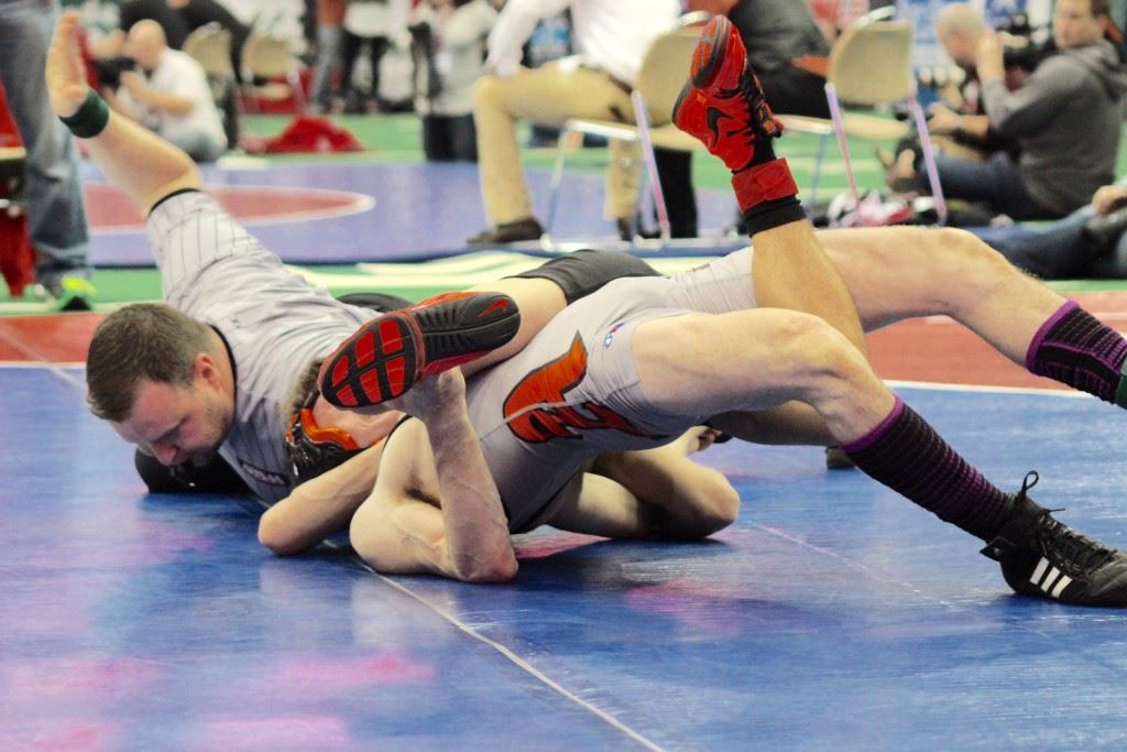 Weaver junior Nick Souder has Alexandria senior Lane Trapp in a tough spot and about to close out their 113 state championship match Saturday. On the cover, Trapp (L) and Souder get things started. (Photos courtesy of Angela Trapp)