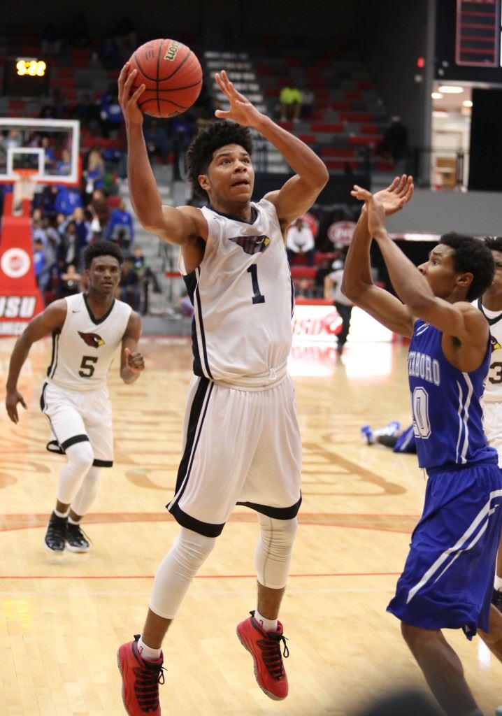 Diante Wood was all over the place for Sacred Heart on Monday. He scored 43 points and grabbed 22 rebounds as the Cardinals won the Class 1A Northeast Regional. Below, Sam Miller (R) and the Cardinals come out for their prize. (Photo by Kristen Stringer/Krisp Pics Photography)