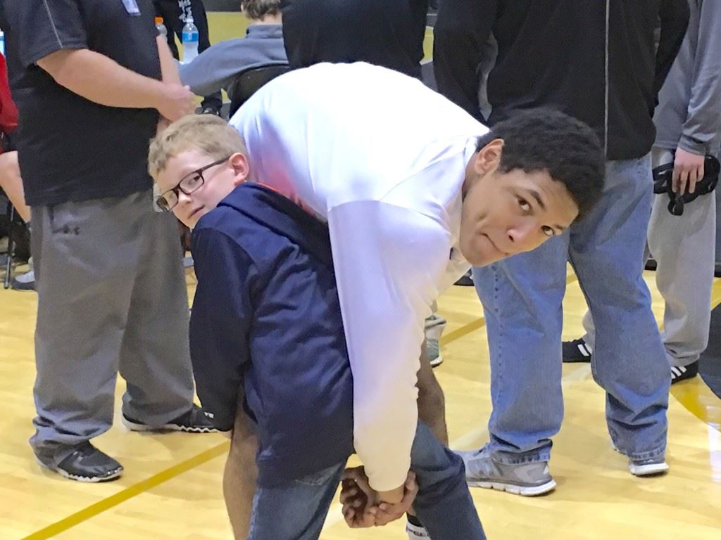 Alexandria freshman Christian Knop, the school's first wrestling state champion, has some fun with Hayden Hartzog, the son of Valley Cubs coach Frank Hartzog, at the State 14U and Cadet Championship Saturday.