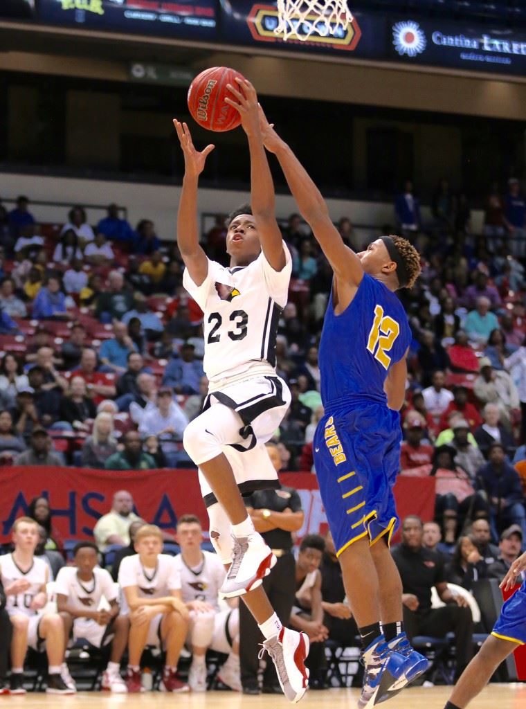 Kevion Nolan (23) goes around Keith's Justyn Pettway for two of his 20 second-half points in Friday's Class 1A state semifinal game. (Photos by Kristen Stringer/Krisp Pics Photography)