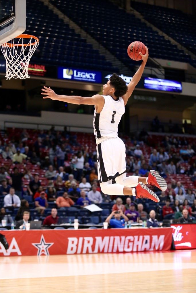 Diante Wood soars through the air for a first-half dunk Friday. On the cover he displays his ballhandling skills. Wood had 17 points and 12 rebounds and after the game reportedly received a scholarship offer from Samford. (Photos by Kristen Stringer/Krisp Pics Photography).