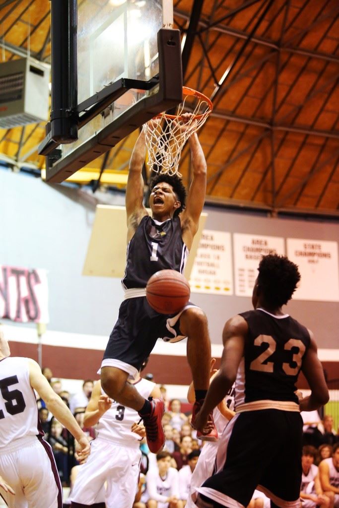 Sacred Heart's Diante Wood (1) throws down one of his alley-oop dunks against Donoho. Kevion Nolan (23) delivered the pass. (Photo by Kristen Stringer/Krisp Pics Photography)