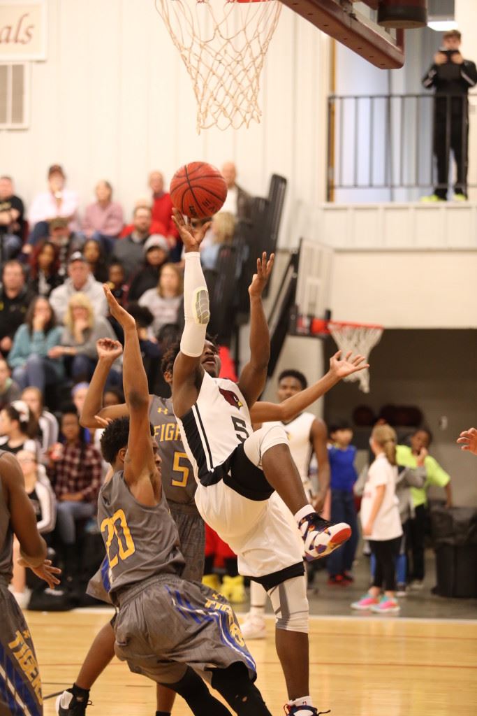 D.J. Heath tries to hold his balance while taking a shot against TCC Tuesday night. (Photo by Kristen Stringer/Krisp Pics Photography)