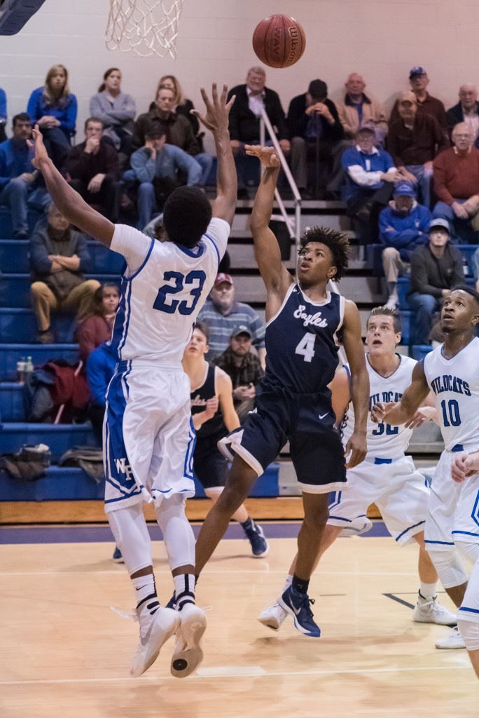 Jacksonville's Cam Horton (4) filled the box score in the final game of his high school career Friday night. He had 32 points, eight rebounds and a lot more. (Photo by Stephen Miller)