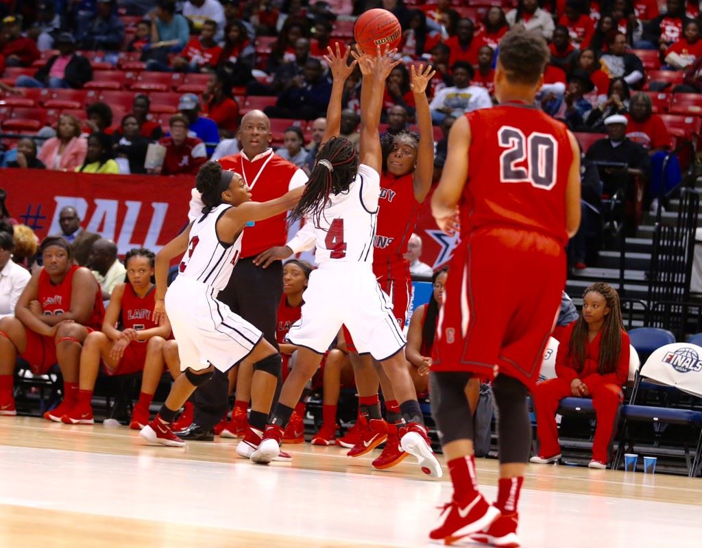 Raven Cooley (4) and Miajah Bullock (3) display the tight defense that got Anniston back in its Class 5A girls semifinal Wednesday. (Photo by Kristen Stringer/Krisp Pics Photography)