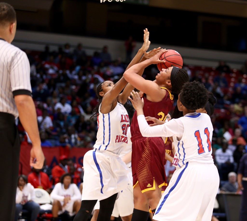 Tournament MVP Tykeah Rogers fights through two Linden defenders to get to the basket Thursday. That was the want-to Lady Panthers coach Ricky Austin was talking about that drove his team to the title. (Photo by Kristen Stringer/Krisp Pics Photography) 