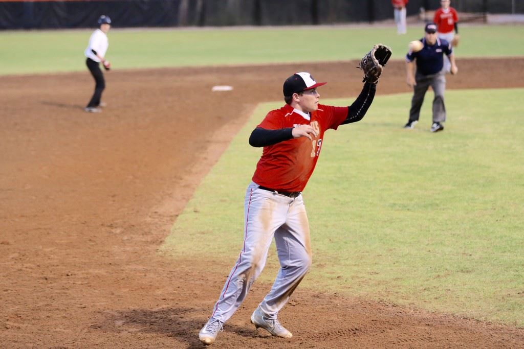 Weaver senior Josh Langley fields a high chop at third base during Friday's Calhoun County Tournament opener with Jacksonville Christian. (Photos by Kristen Stringer/Krisp Pics Photography)