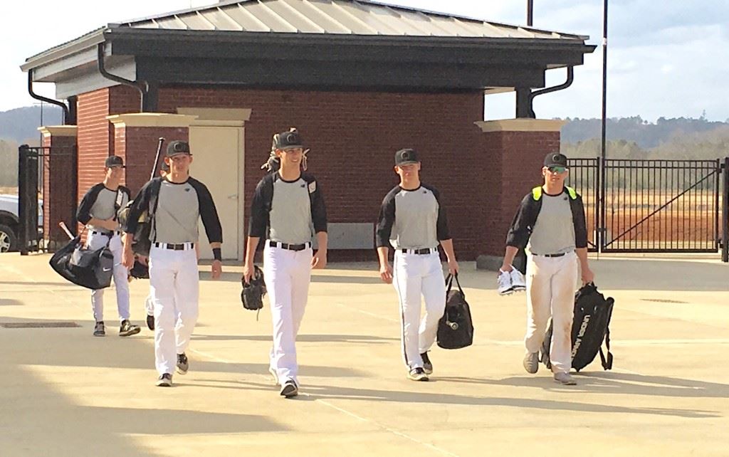 Oxford's earliest arriving players make their way into Choccolocco Park for their first practice on the signature baseball field. 