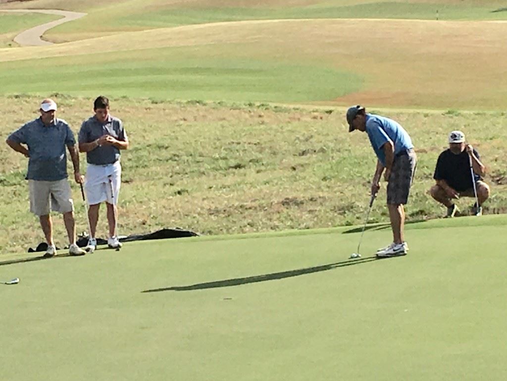 The teams of Ott and Dalton Chandler (left side) and Kevin Daugherty (putting) and Jeff Champion were chasing the leaders and battling for second the entire back nine Sunday. They were a combined 13-under-par on the back.