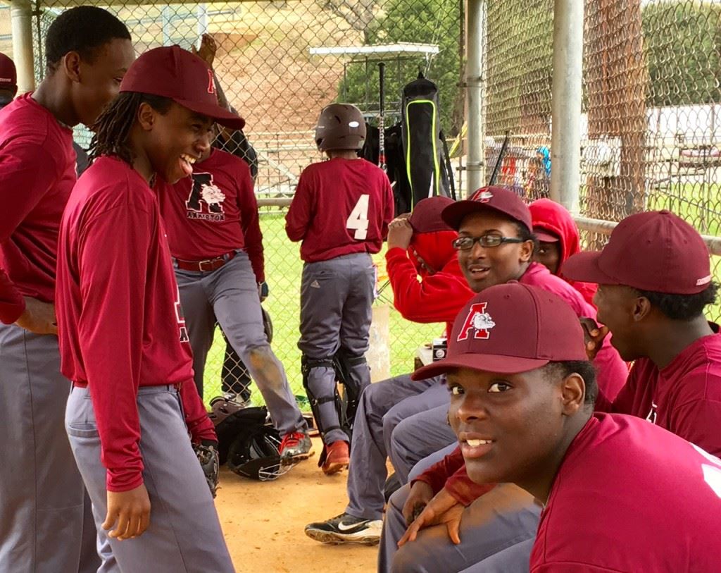 The Anniston dugout manages to keep a good attitude despite being down on the scoreboard. Tae Bush (in glasses) pitched two good innings before it got away from him in the third.