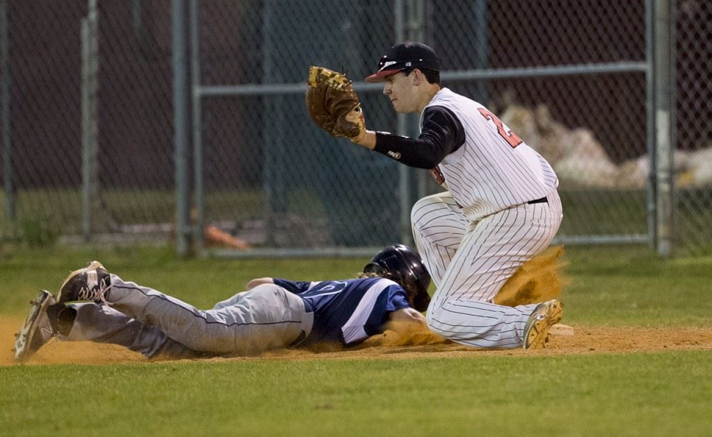 A Jacksonville runner gets back to the bag before Cleburne County first baseman Jordan Brown (2) can get down a tag. (Photo by Jonathan Fordham/J&E Art&Design) 