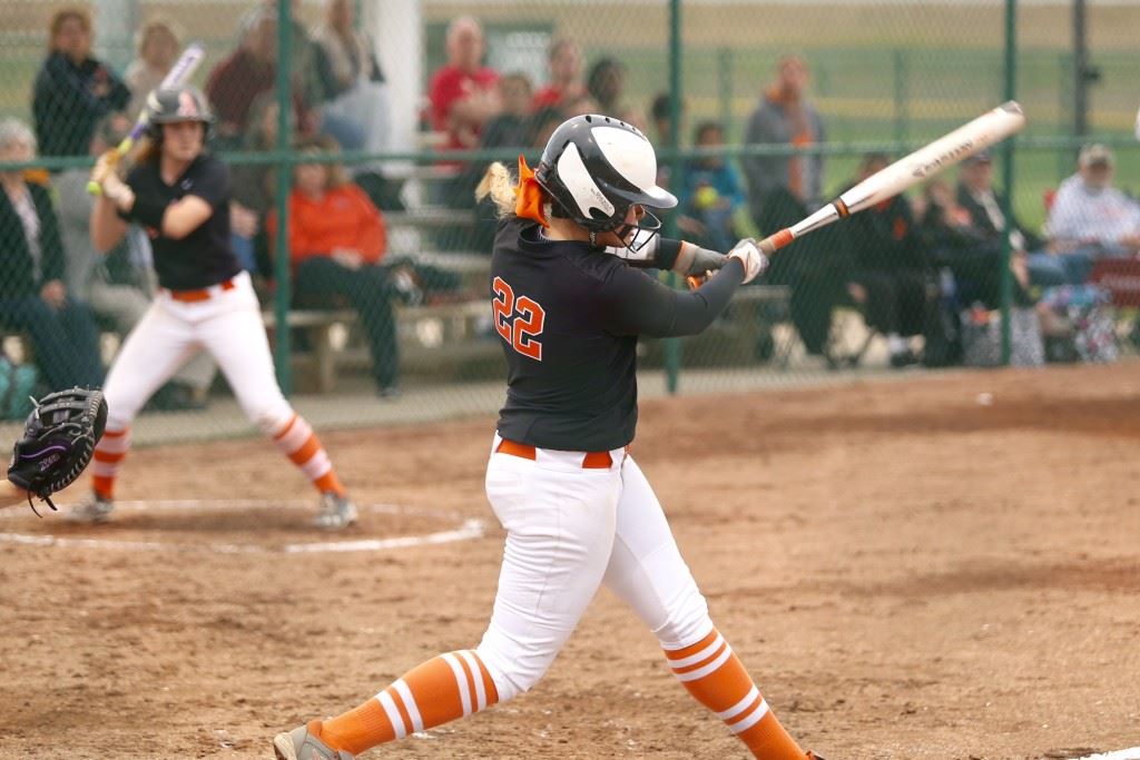 Alexandria's Lauren O'Dell pulls a three-run homer down the left-field line to break a 1-1 tie. On the cover, McKinley Parris hit a three-run homer to give Pleasant Valley the lead against top-seeded Oxford. (Photos by Kristen Stringer/Krisp Pics Photography)