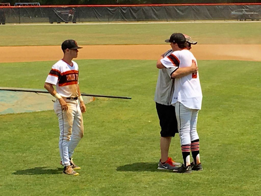 Alexandria pitcher Cody Dodd (R) gives/gets one last hug from his father Jimmy after pitching the Valley Cubs to a series sweep of Mortimer Jordan Saturday.