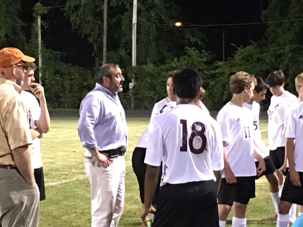 Donoho soccer coach Matthew Wright tells his team at halftime it's OK to be a little more aggressive in the second half of their game with Collinsville. 