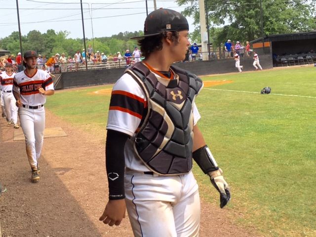 Alexandria catcher Mitch Welch looks back across the field after handling Cody Dodd's series-clinching victory last weekend. Below, catching cousins Millie Burt (L) and Mitch Welch on a day the Cubs' softball and baseball teams played.