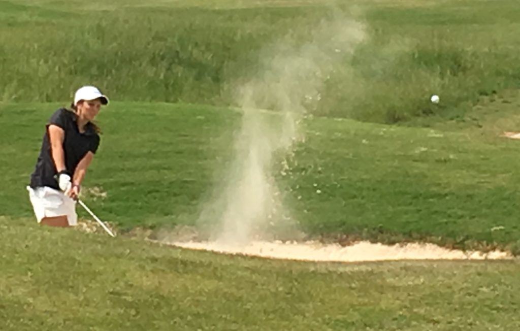 White Plains' Layne Dyar blasts out of the greenside bunker on Highlands No. 11.