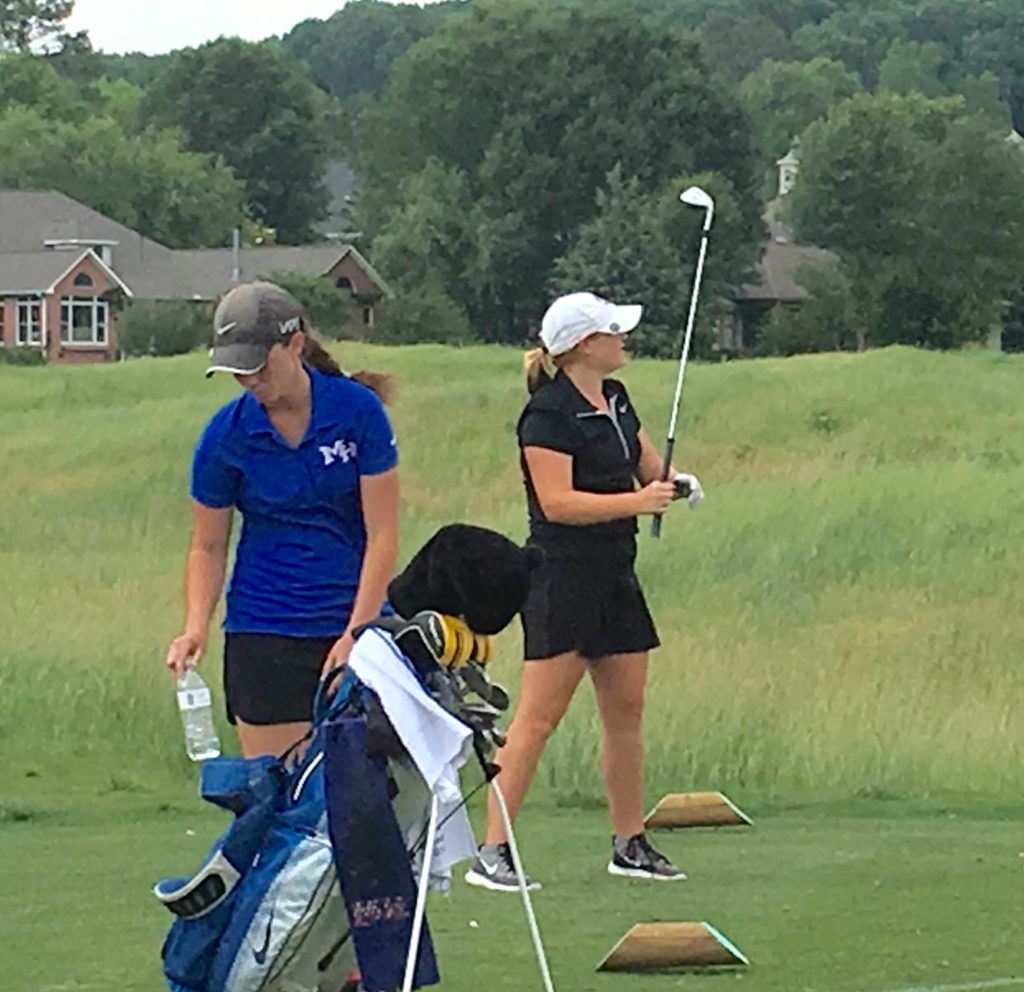 JCA's Chloe Borders follows her tee shot on the par-3 11th Tuesday. On the cover, she walks to the 12th tee for a shot that was key to her championship. Below, she displays her low medalist award.