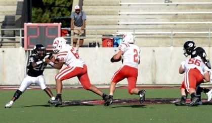 Ohatchee linemen Caleb Montgomery (62) and Jacob Lowe clear a wide path for Jessie Sellers to run through in the Indians' spring game with Wellborn. (All photos by B.J. Franklin/GungHo Photos)