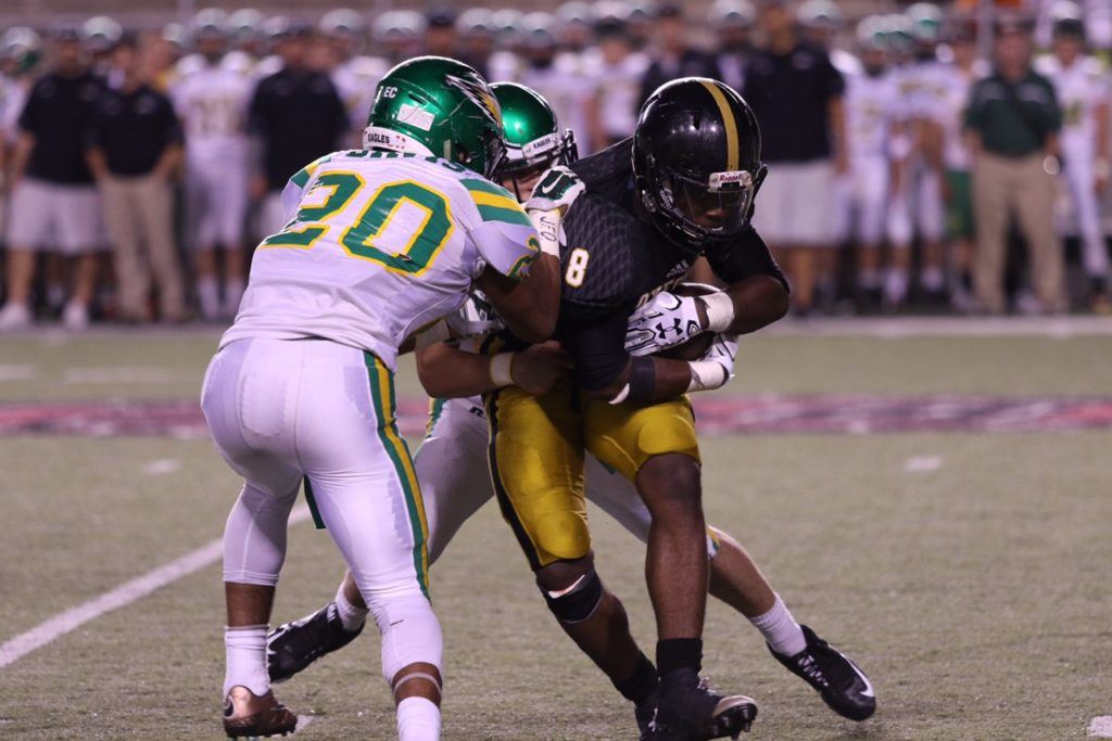 Jordan Swain (8) gave Oxford some hard running in its spring game. On the cover, Kenney Britt Jr. made nine tackles and played tight end on offense. (Photos by Kristen Stringer/Krisp Pics Photography)