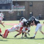 Wellborn's Pat Harris (26) fights for yardage.