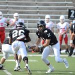 Wellborn quarterback Austin McQueen puts a play in motion.