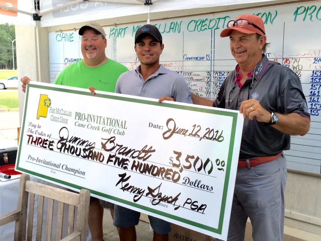 Jimmy Brandt (C) shows off the big winner's check after going wire-to-wire to win the Fort McClellan Credit Union Pro-Invitational at Cane Creek GC. On the cover, Brandt waits in the scoring area to post his score after the round.