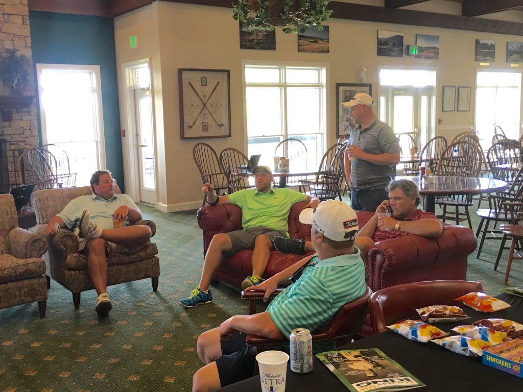 Players at Silver Lakes watch the scores come in from Friday's opening round of the Sunny King Charity Classic. 