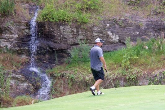 A flowing waterfall adds a nice touch to the scene around Cider Ridge's 14th green.