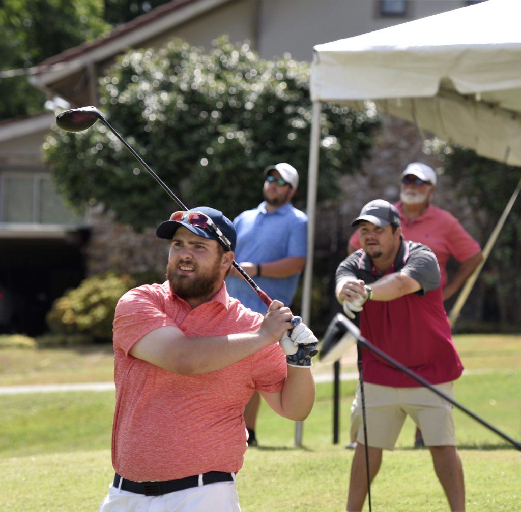 Caleb McKinney watches the flight of his drive on No. 17 at Anniston CC after nearly holing an ace on the par-3 16th. (Photo by Sandra Howell)