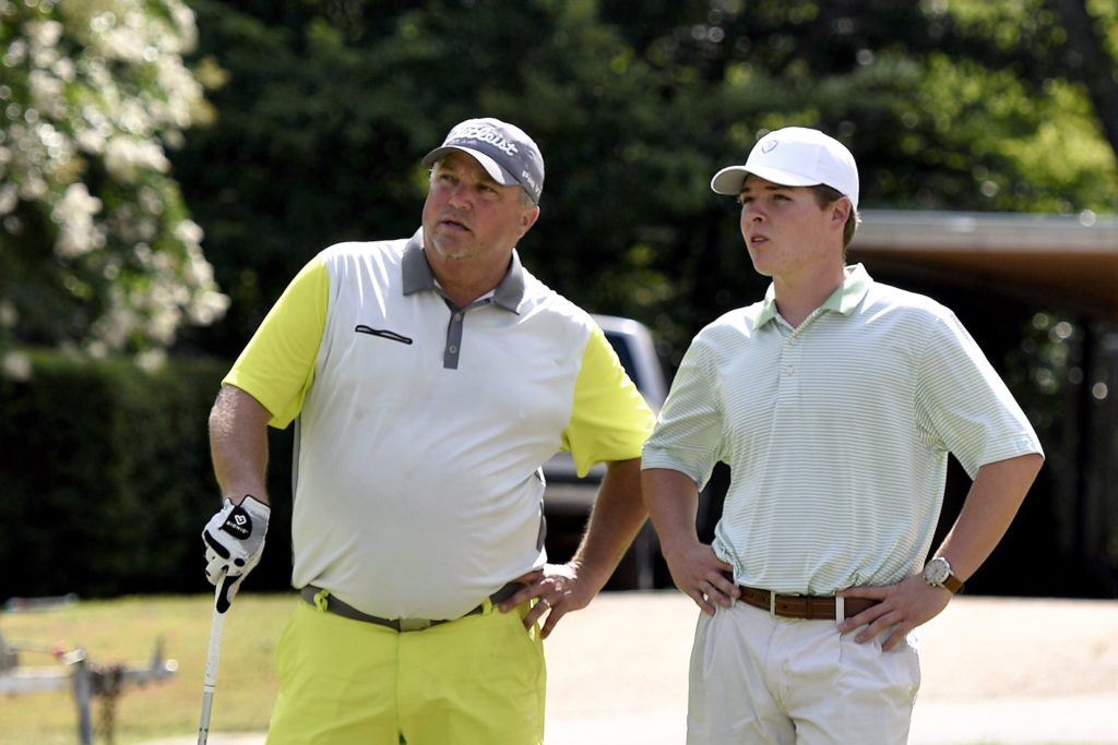 Lewis Lecroy (L) talks with interested spectator Logan Archer while waiting to hit Sunday. Archer, a former Oxford golfer, is transferring to North Georgia College from West Alabama in the fall. (Photo by Sandra Howell)