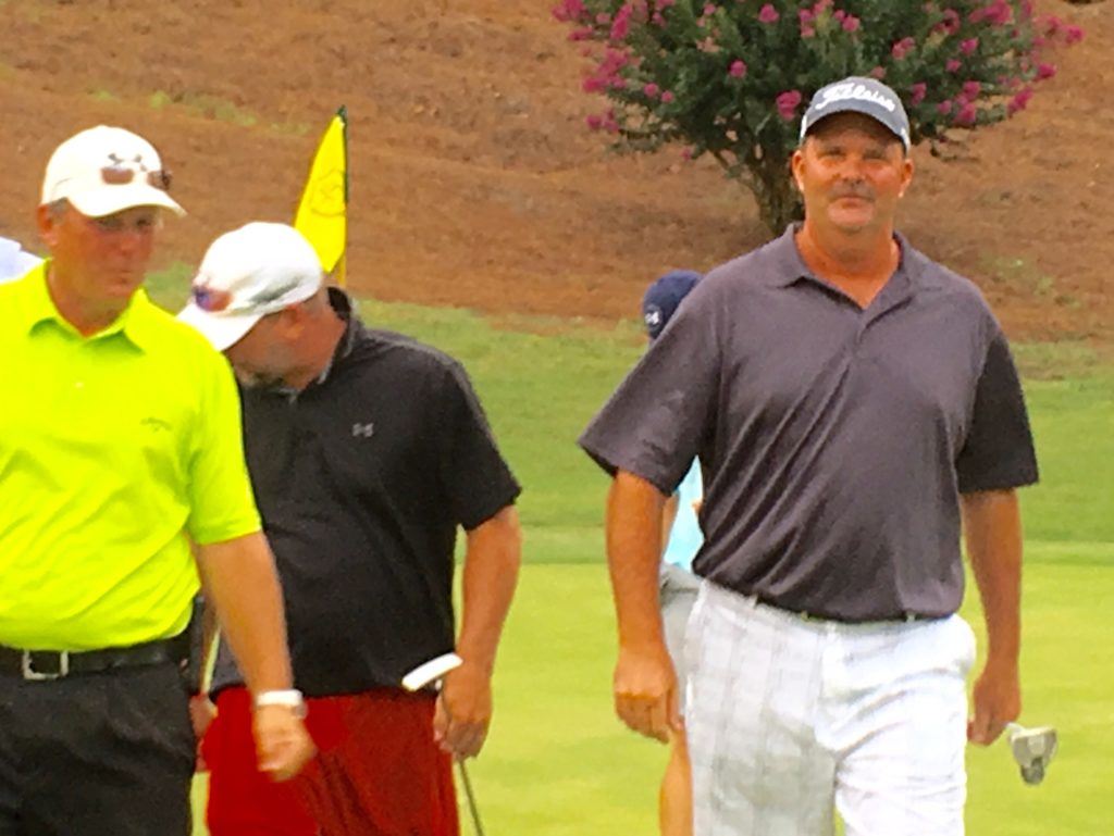 Randy Reaves (L) walks off the 18th green with former partner Gary Wigington (R) and Ty Cole after the new partners won the Sunny King Charity Classic Sunday. It was Wigington's sixth win, tying him with Reaves for most in tournament history.