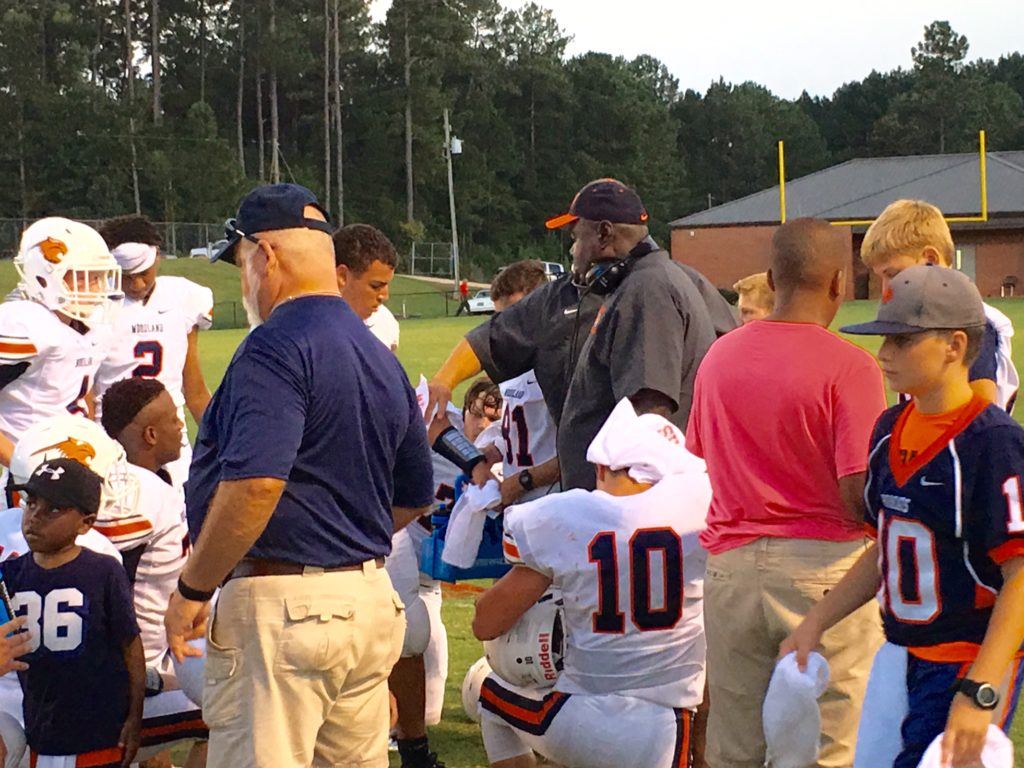 Woodland coach Randy Boyd talks to his players during a time out in the first half of Thursday's game.