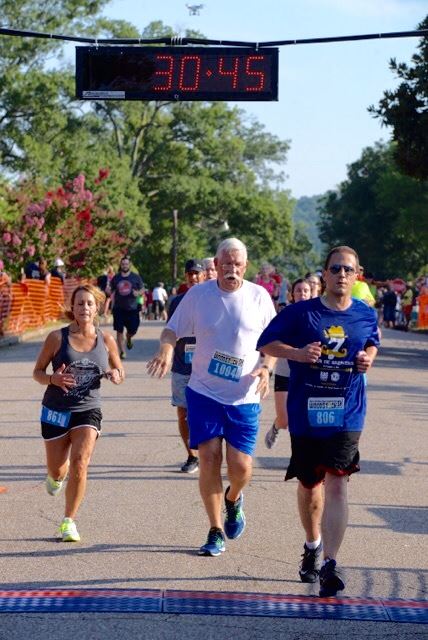 Paul Mathews of Birmingham (806), Farrell Turner of Heflin (1004) and Carmen Page of Cataula, Ga. (861) jockey for position at the finish line.
