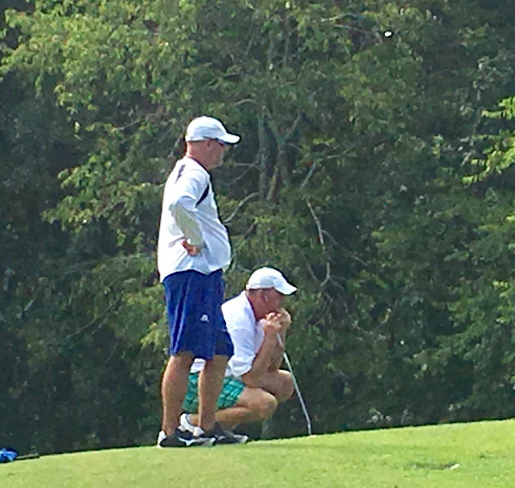 Ty Cole (L) and Gary Wigington, the top two players in the Calhoun County Golf Tour points standings, survey similar-length putts from the fringe on No. 11 Saturday. On the cover, Jeremy McGatha tees off at 11 on his way to a 61.