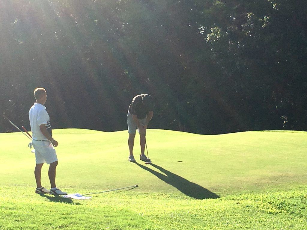 Ott Chandler stands over his tournament-winning putt on the second hole of sudden death Sunday.