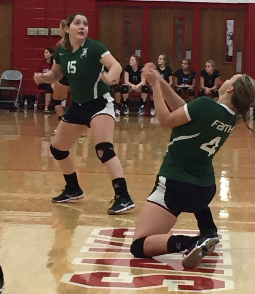 Cornelia Simpson (4) digs one out for Faith Christian during its championship match with Pleasant Valley.