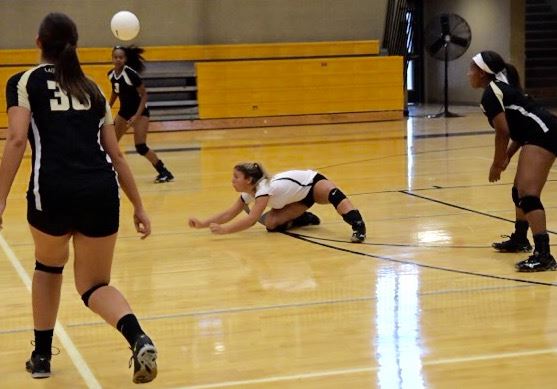 Oxford libero Alex Hammond goes after one of her 27 digs in Tuesday's match against Jacksonville. (Photo by B.J. Franklin/GungHo Photos)