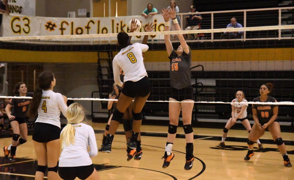 Oxford's Nyia Archie (8) puts one of her kills past Alexandria's Taylor Spradley Tuesday night. (All photos by B.J. Franklin/GungHo Photos) 