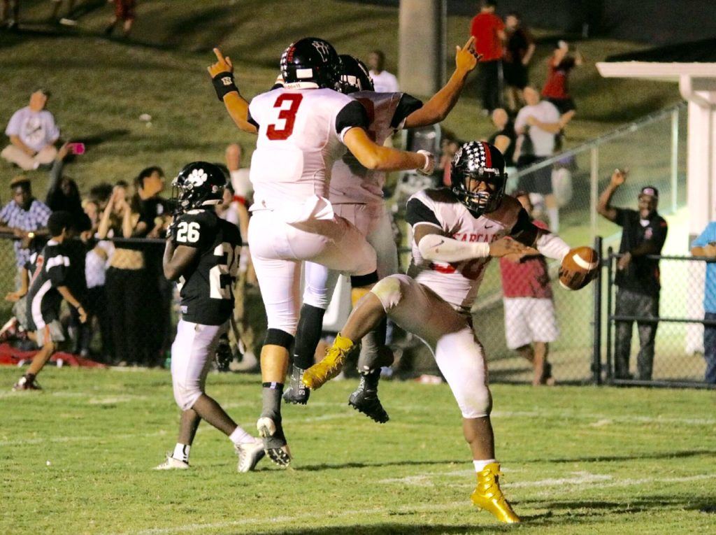 Tyrik Hall (30) gets his gold cleats in the end zone in the fourth quarter against Wellborn last week. (Photo by Daniel Lee)