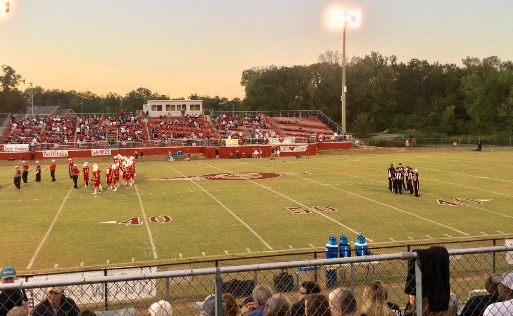 It's about 30 minutes before kickoff, Ohatchee goes through its pregame routine and the officials huddle in the vacant end of the field while everyone waits for Wellborn to arrive. 