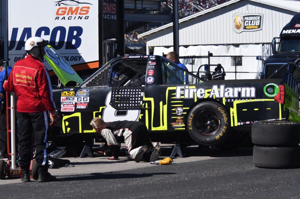 Team members work to figure out just went wrong to cause Chase contender John Hunter Nemechek's engine to go early in the race. (Photo by B.J. Franklin/GungHo Photos)