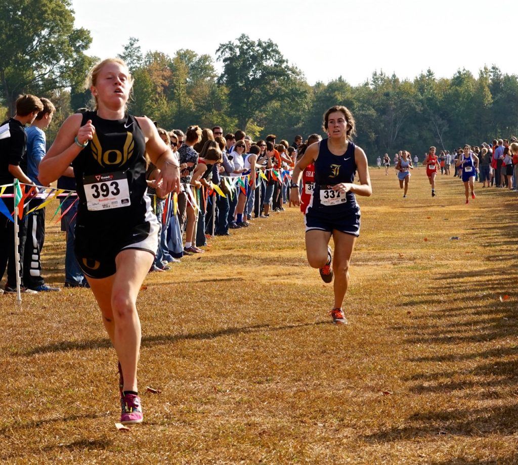 Oxford's Toni Coley (L) sprints to an eighth-place finish ahead of Jacksonville's Mary Shelton.